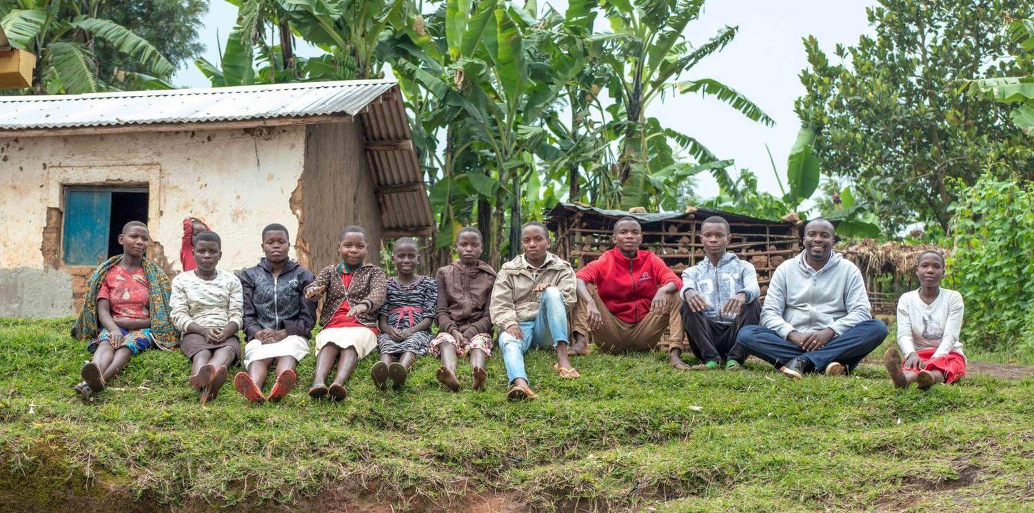 Members of a Communities of Hope village gathered on their hillside